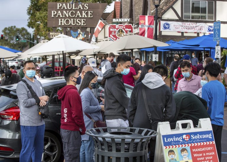 California town says no to tough virus rules, then yes