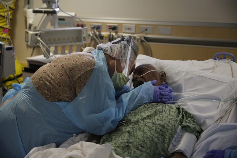 US COVID-19 deaths top 300,000 just as vaccinations begin