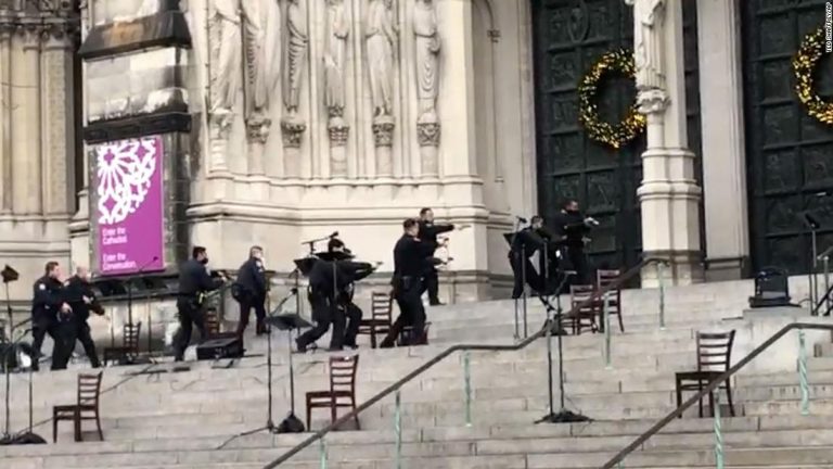 A gunman is dead after a shooting at a New York City cathedral Christmas concert
