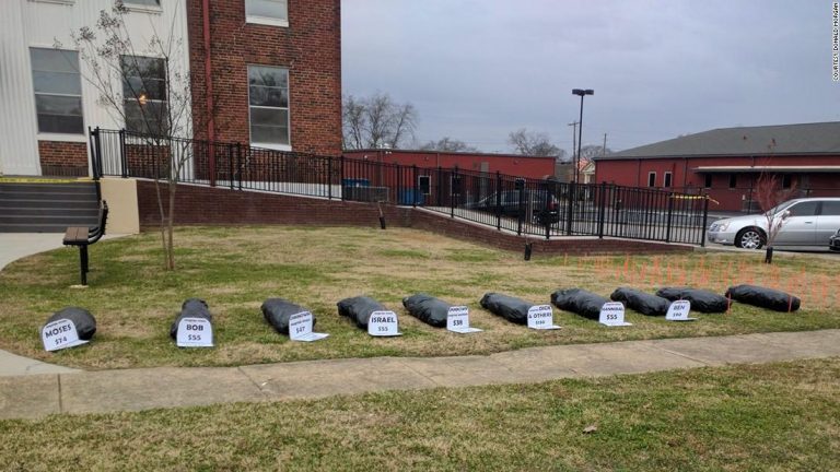 Group of Alabama protesters places fake body bags on courthouse lawn
