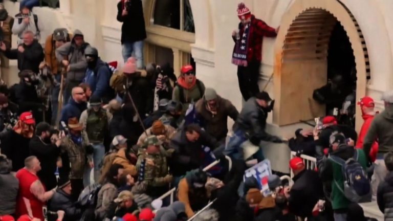 Democrats begin impeachment trial with stunning riot video