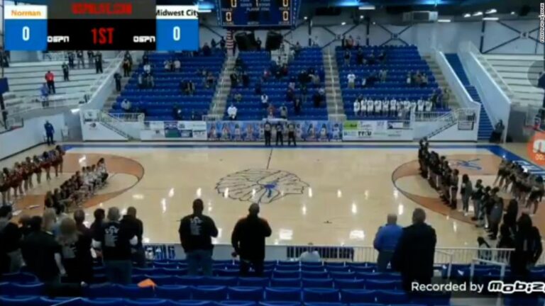 An announcer hurled racist insults at a high school basketball team for kneeling during the US anthem