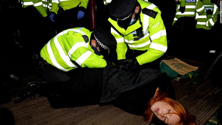 London police chief faces calls to resign after officers smash vigil to murdered woman