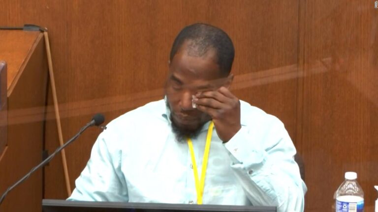 Witness wipes away tears listening back to his call to 911