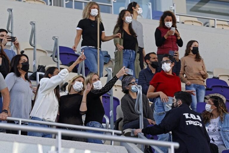 With many vaccinated, Israel reopens economy before election