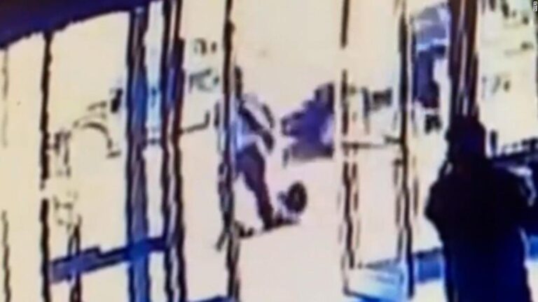Two doormen who closed doors while Asian woman was attacked have been fired