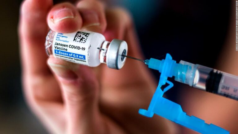 Federal health agencies say vaccinations should resume as warning will be added to label about rare blood clots