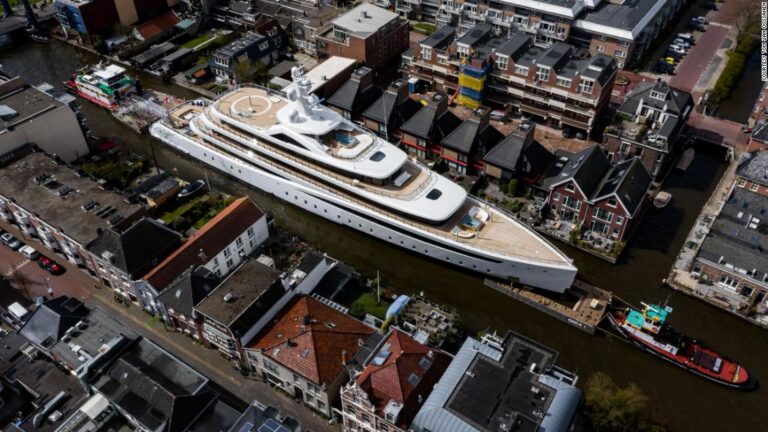 Huge superyacht squeezes down narrow Dutch canals