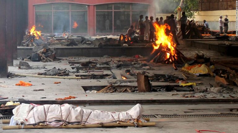 As India’s crematoriums overflow with Covid victims, pyres burn through the night