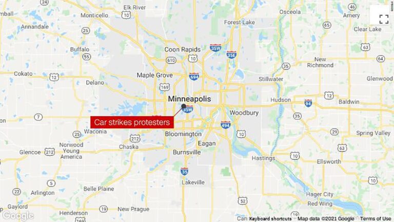 A woman is dead after a car drove through a crowd of protesters in Minneapolis, police say