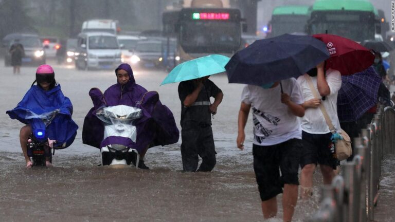 Passengers trapped inside submerged subway as deadly floods sweep central China