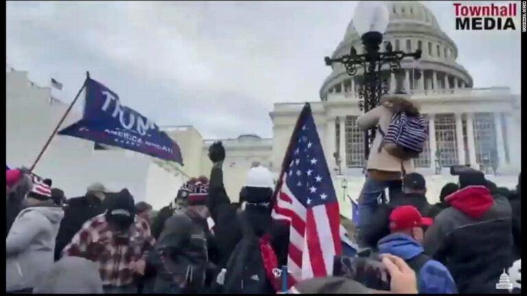 New video of riot shown at insurrection hearing