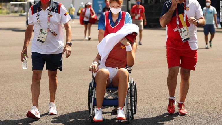 Spanish tennis player retires with heatstroke and leaves court in wheelchair