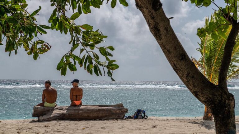 Dream vacation spot has two major problems: Debt and climate crisis
