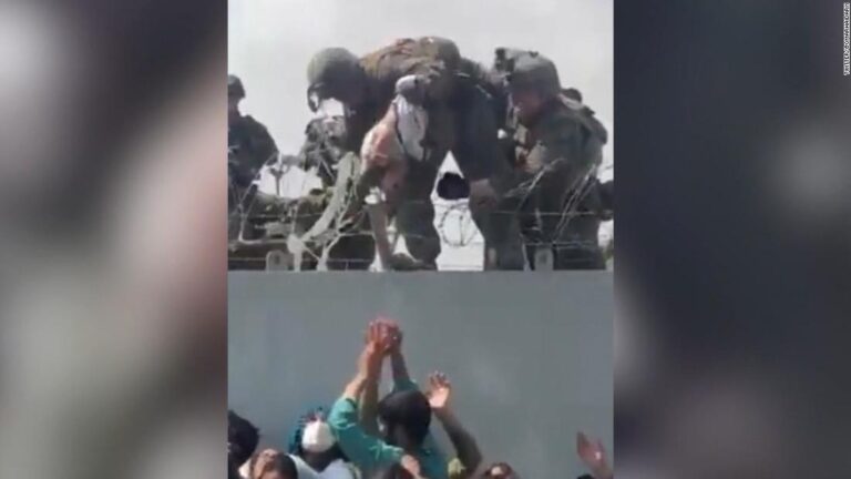 Video shows baby being handed over Kabul airport wall to US troops
