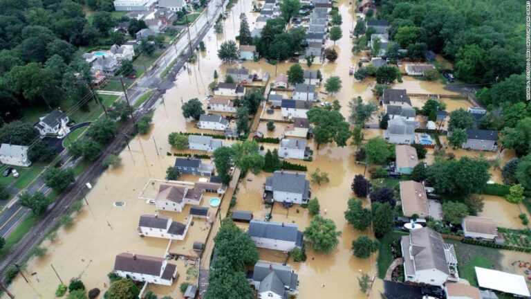 Crews work to restore power for tens of thousands as Henri drenches US Northeast