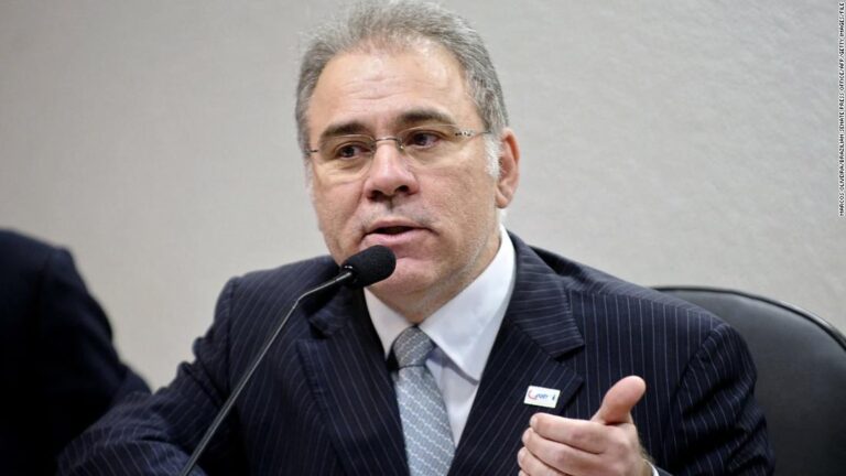 Brazil’s health minister appears to flip middle fingers at protesters