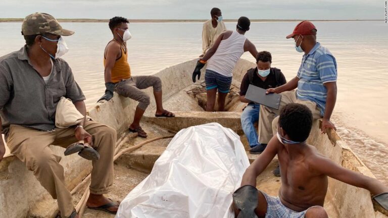 Men are marched out of prison camps. Then corpses float down the river