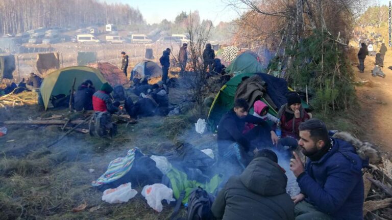 Fears of violence escalate on Poland-Belarus border as thousands of migrants set up camp