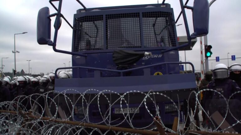 Water cannons aimed at migrants in tense border standoff