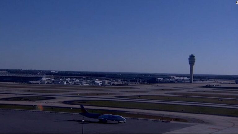 An accidental weapon discharge at Atlanta airport caused panic and halted flights