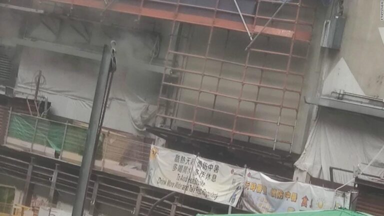 150 trapped on roof after fire in busy Hong Kong district