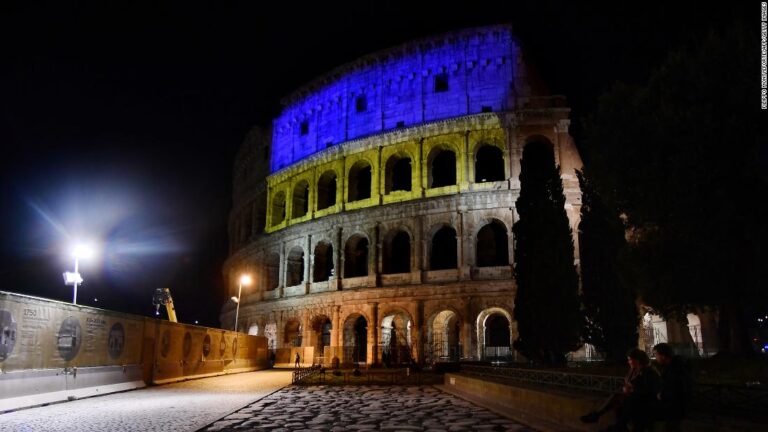 Landmarks around the world glow blue and yellow in support of Ukraine