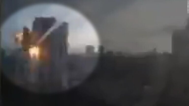 Video shows missile or rocket striking building in Kyiv