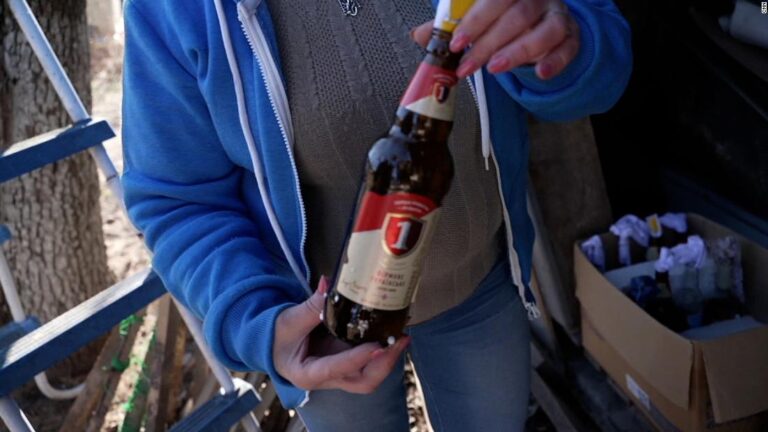 Ukrainian woman shows CNN reporter her makeshift Molotov cocktails