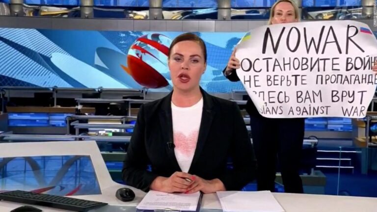 Russian state TV broadcast interrupted by protester with anti-war sign