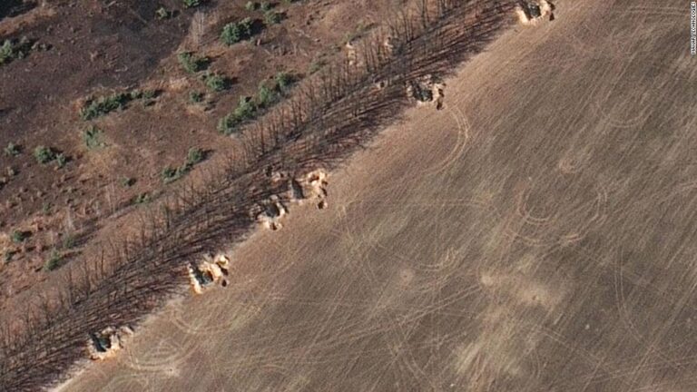 Russian forces dig in outside Kyiv as Ukraine says their advance into capital city has been blocked