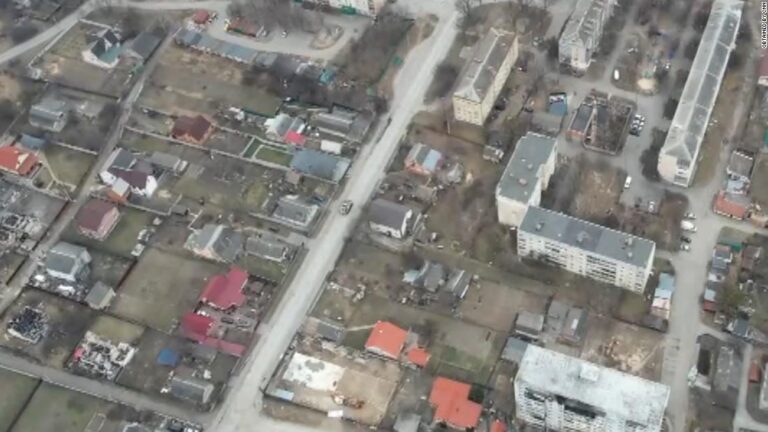 Exclusive new drone video shows Russian vehicles and forces on Bucha street strewn with civilian bodies