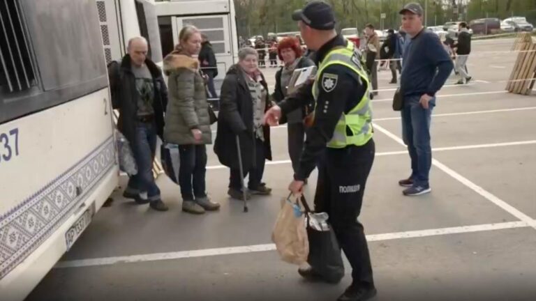 Evacuees from the besieged Azovstal steel plant in Mariupol arrive in the Ukrainian-controlled city of Zaporizhzia