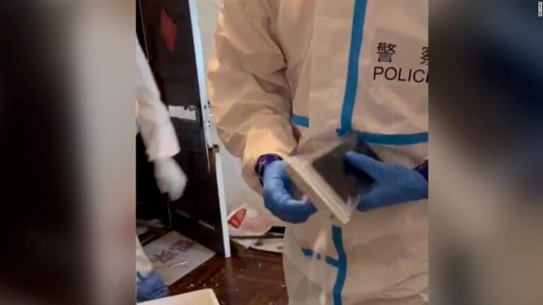 Shanghai police barge down door in resident’s apartment