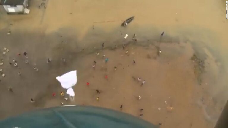 Video shows air force drop supplies to residents stranded by floods