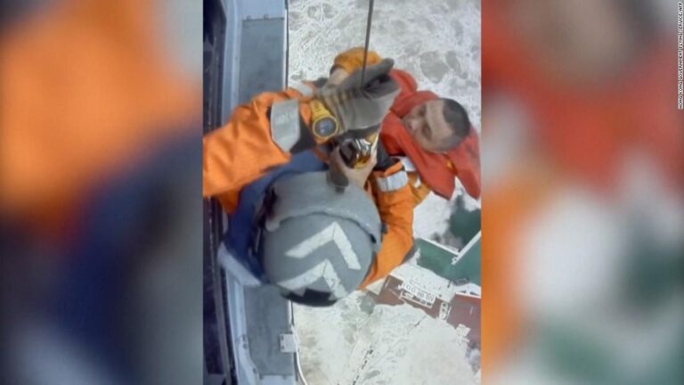 Search for crew after ship caught in typhoon breaks in half