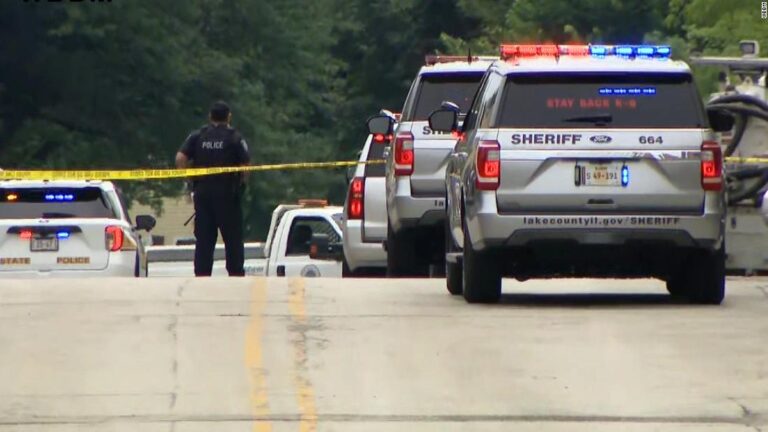 Gunman fired on unsuspecting parade attendees from a rooftop, authorities say