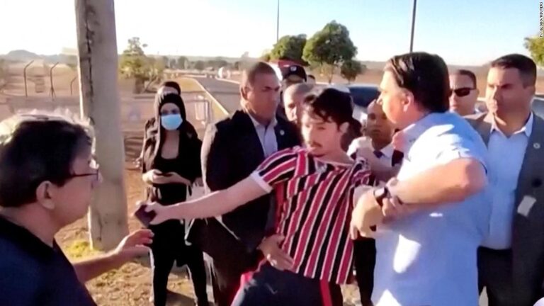 Brazilian President Bolsonaro tries to grab cell phone from YouTube heckler, video shows