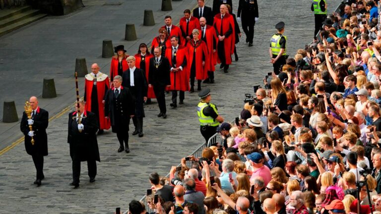 Queen’s coffin arrives at royal residence in Scottish capital, the first leg of her final journey