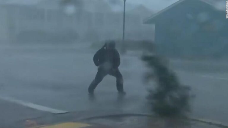 Reporter hit by tree branch while covering Hurricane Ian