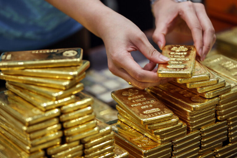 Gold drops below $1,700 on stronger dollar, rate-hike bets