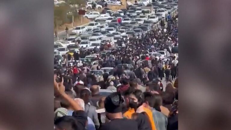 Protesters bring traffic to a standstill as thousands gather at Mahsa Amini’s grave